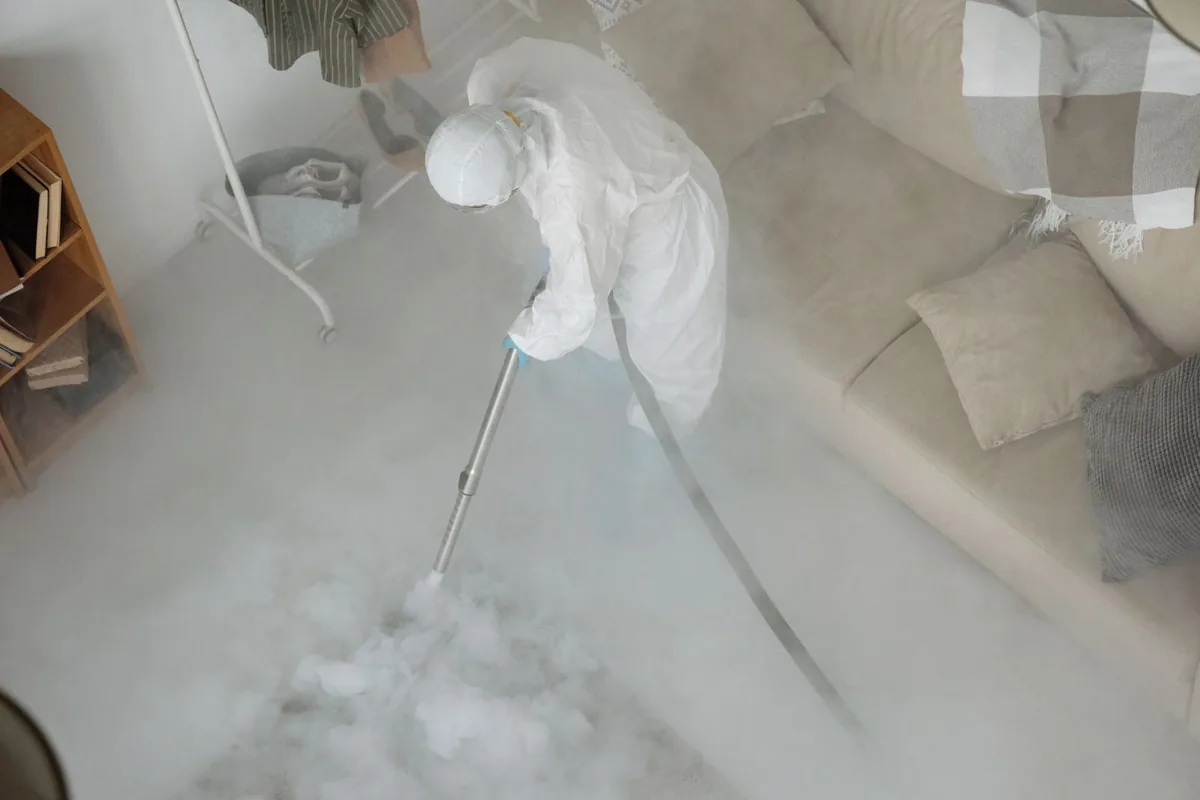 Biohazard cleanup technician in protective equipment, Perham, MN
